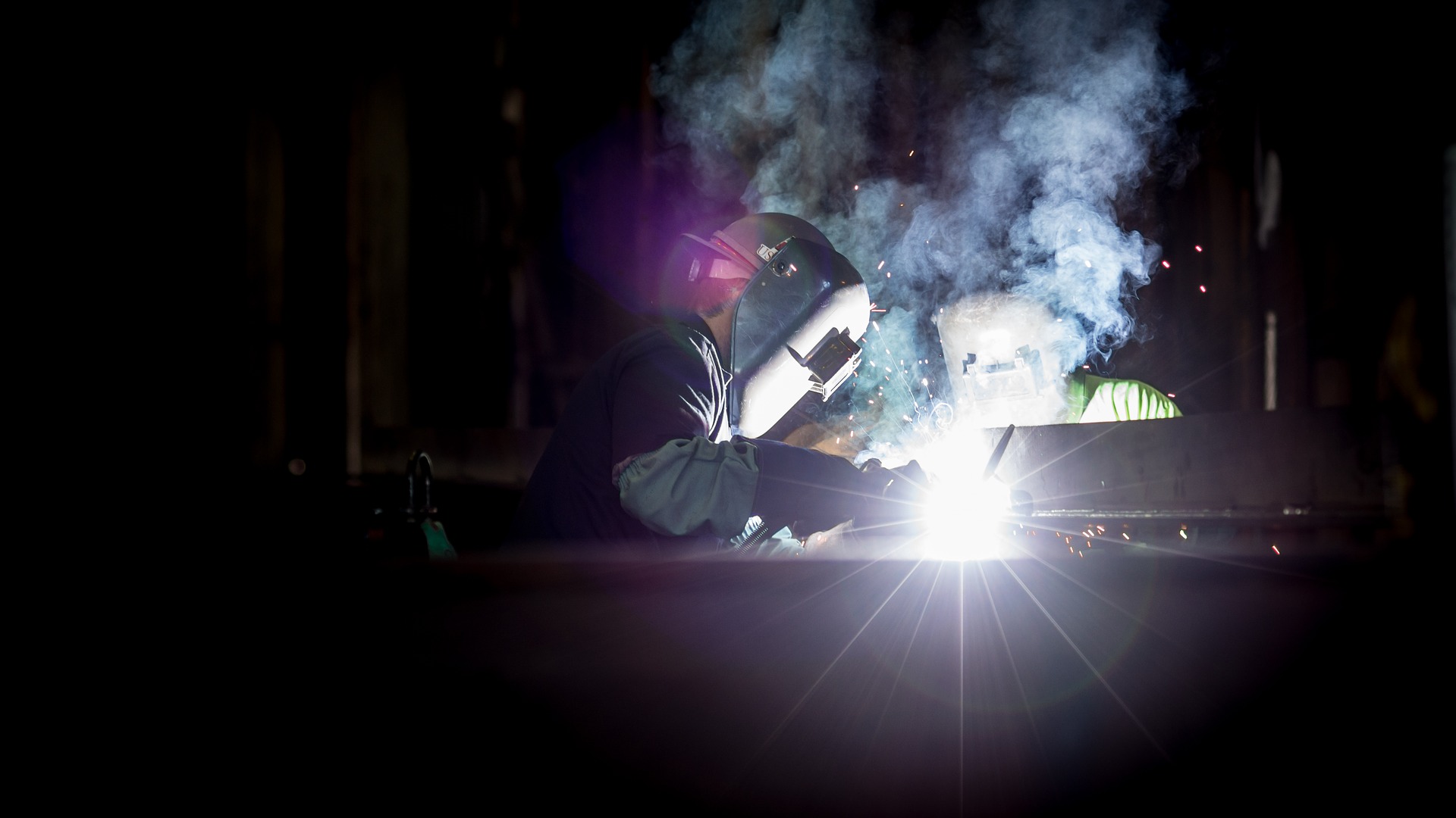 Welder at work at night