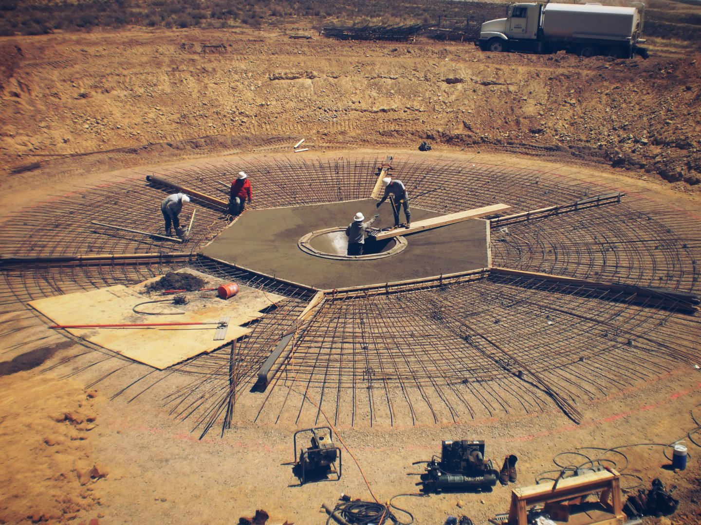 Crew placing a tank ringwall foundation