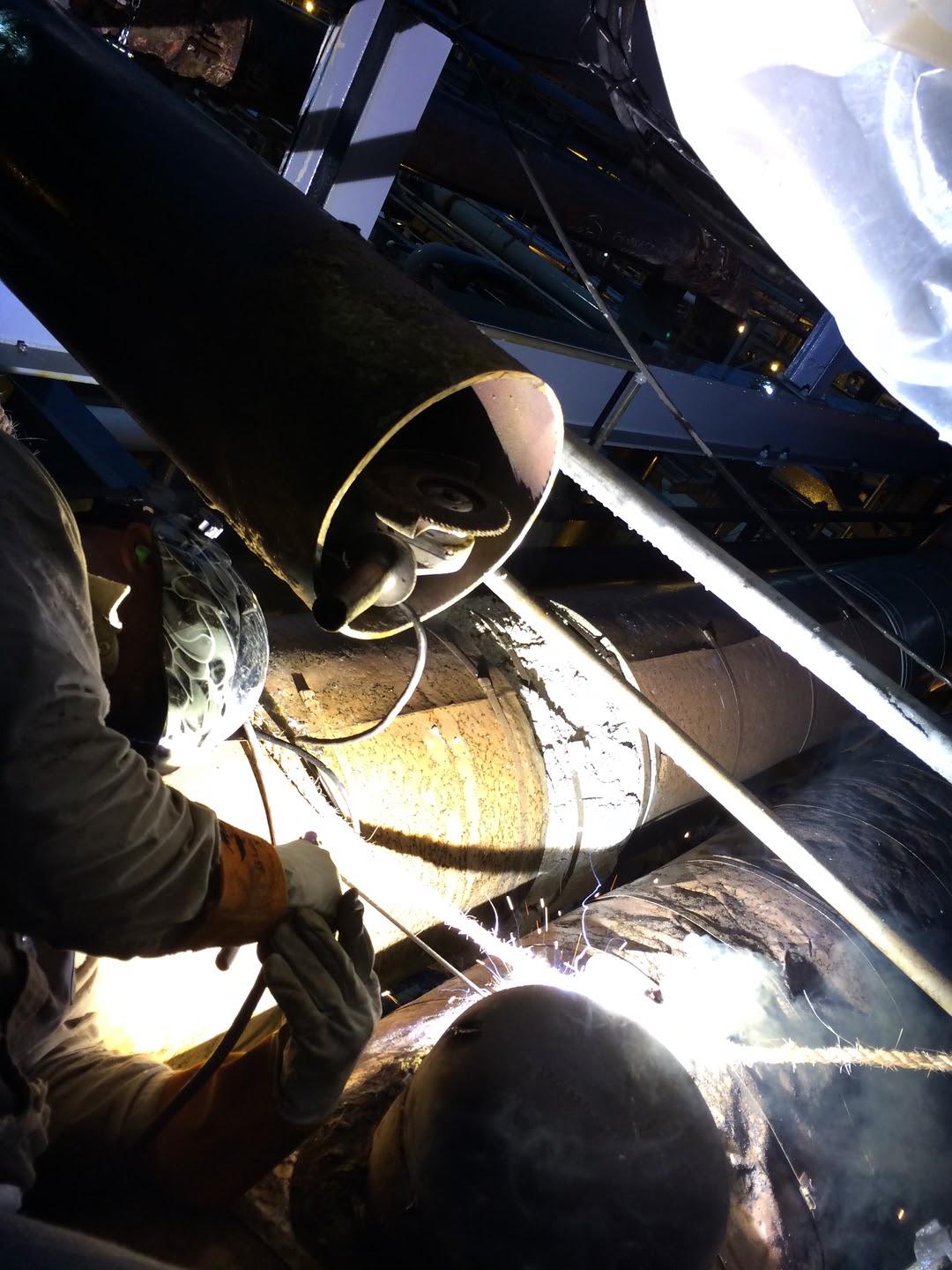 Tesecon welder tying in process pipe on a night shift